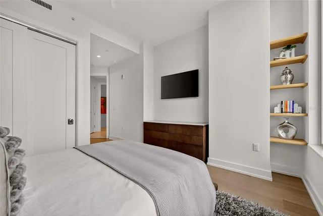 a living room with furniture and flat screen tv