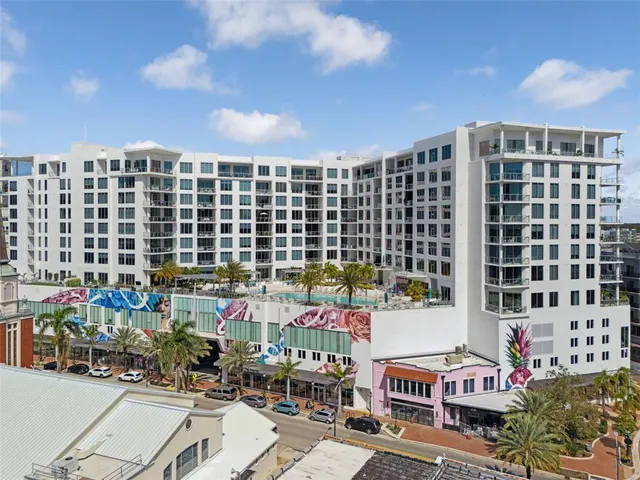 a view of a room with gym equipment and large window