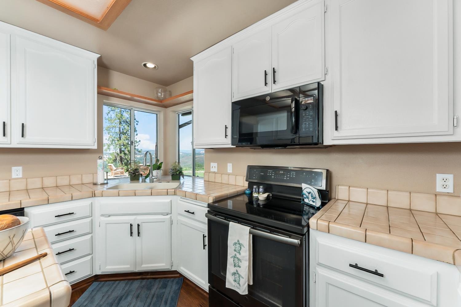 3472 See View Court Rescue, CA 95672 - Photo 8 of 37 a kitchen with a sink stove and microwave
