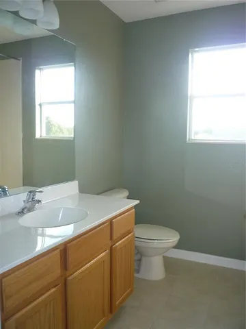 a kitchen with a stove and a window