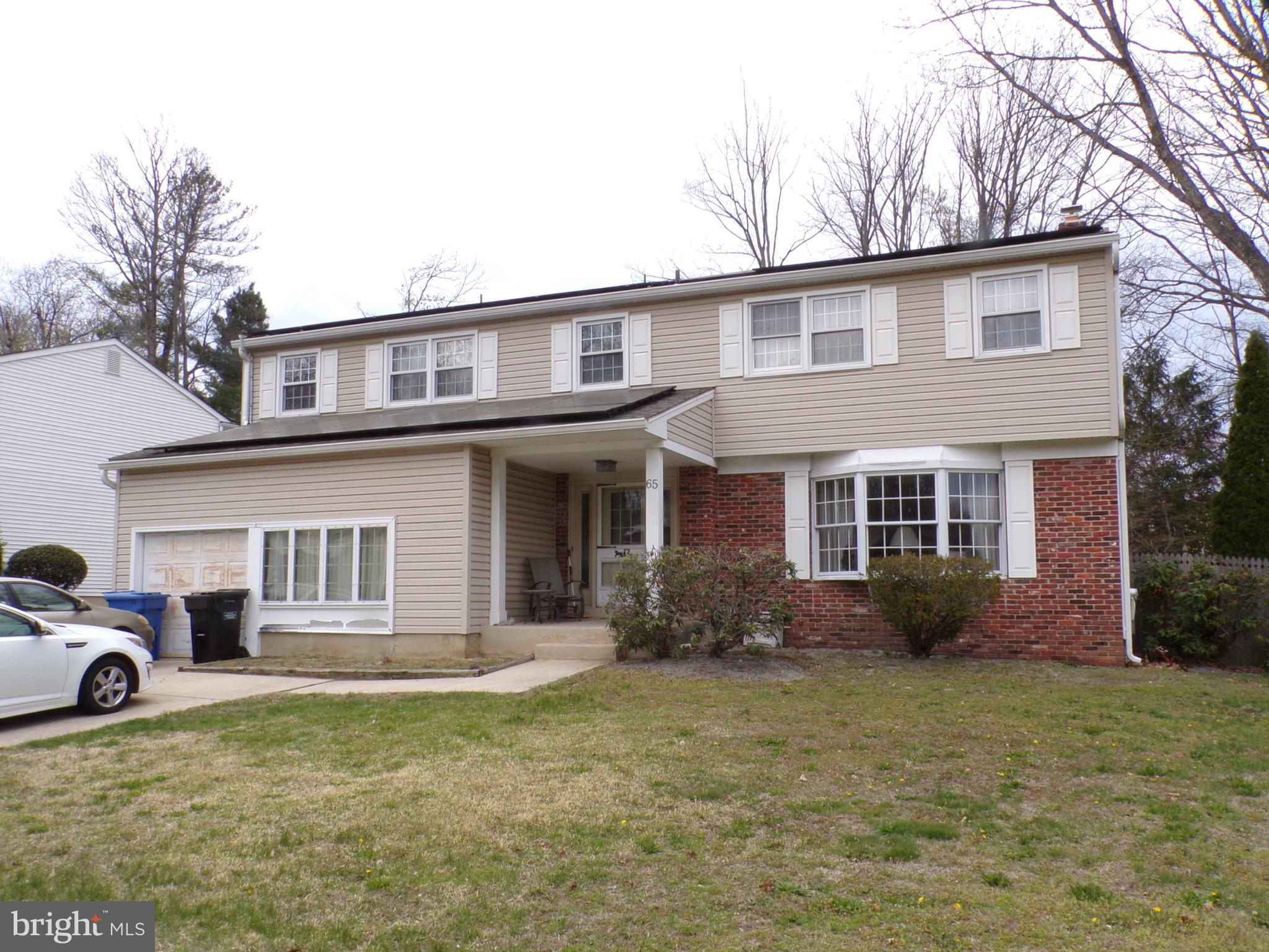 65 Trent Road Blackwood, NJ 08012 - Photo 1 of 23 a front view of a house with garden