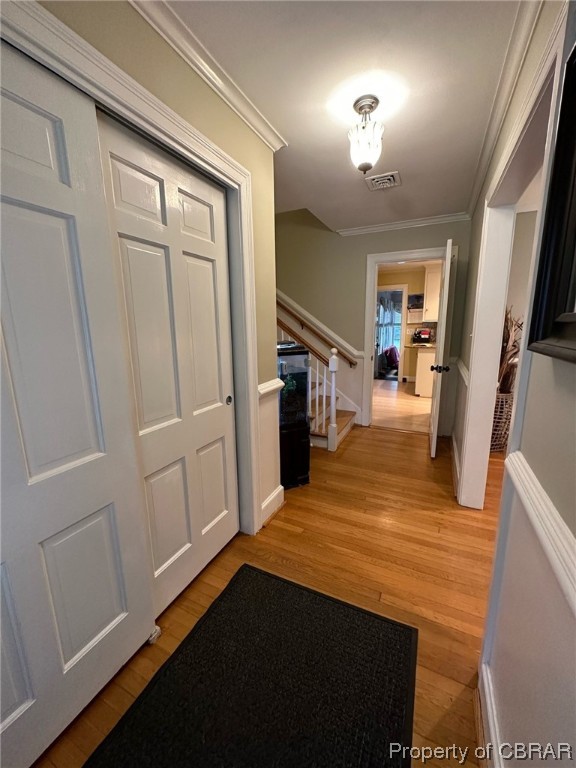 122 Selden Road Newport News, VA 23606 - Photo 3 of 38 Corridor featuring light hardwood floors and ornamental molding