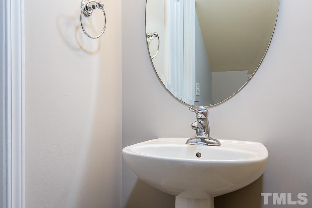 8722 Owl Roost Place Raleigh, NC 27617 - Photo 11 of 26 a sink with a mirror