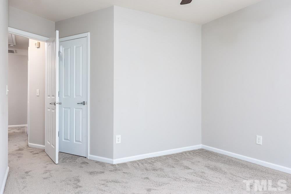 8722 Owl Roost Place Raleigh, NC 27617 - Photo 19 of 26 a view of an empty room
