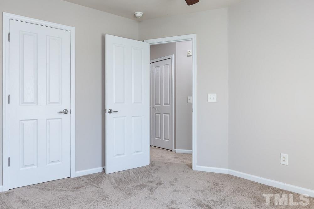 8722 Owl Roost Place Raleigh, NC 27617 - Photo 21 of 26 an empty room with closet area