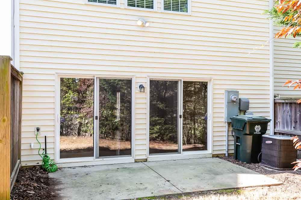 8722 Owl Roost Place Raleigh, NC 27617 - Photo 23 of 26 a view of a house with backyard