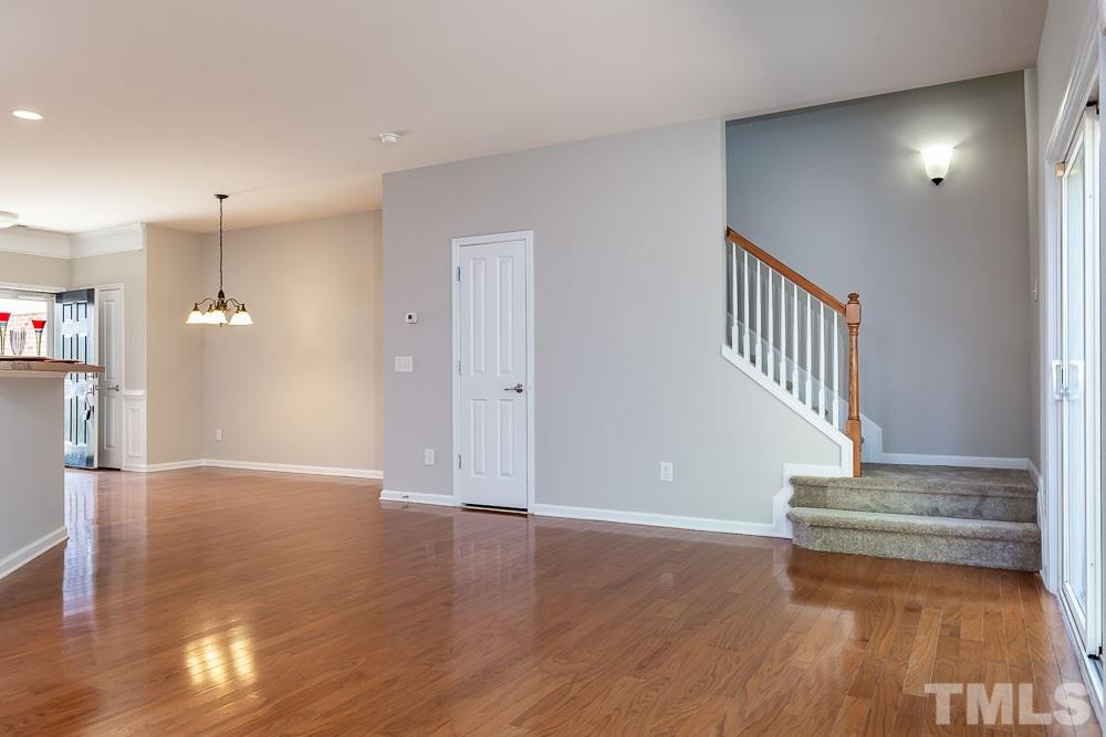 8722 Owl Roost Place Raleigh, NC 27617 - Photo 10 of 26 a view of entryway and hall with wooden floor