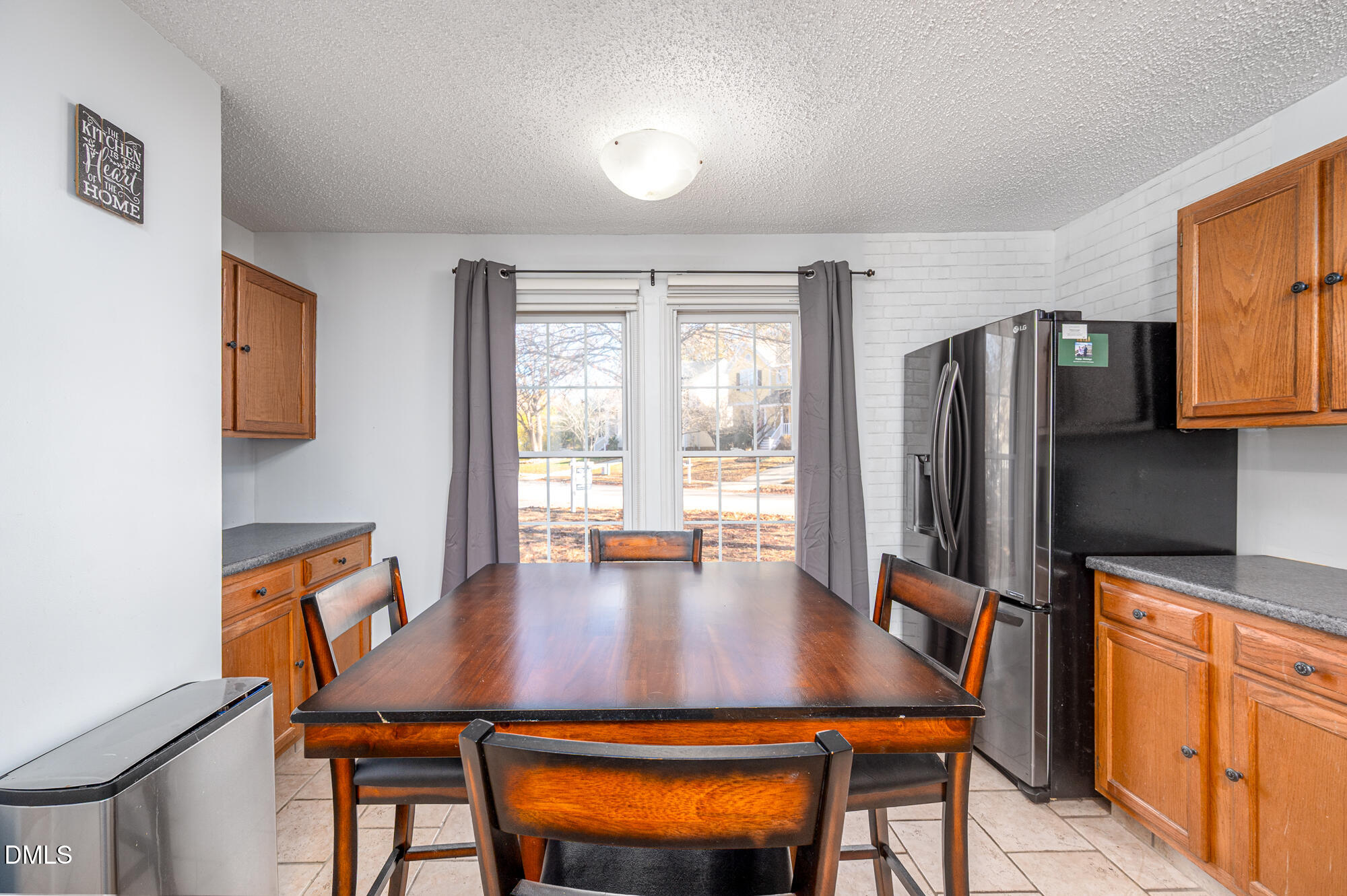 701 Thistlegate Trail Raleigh, NC 27610 - Photo 13 of 53 a view of a dining room with furniture window and wooden floor