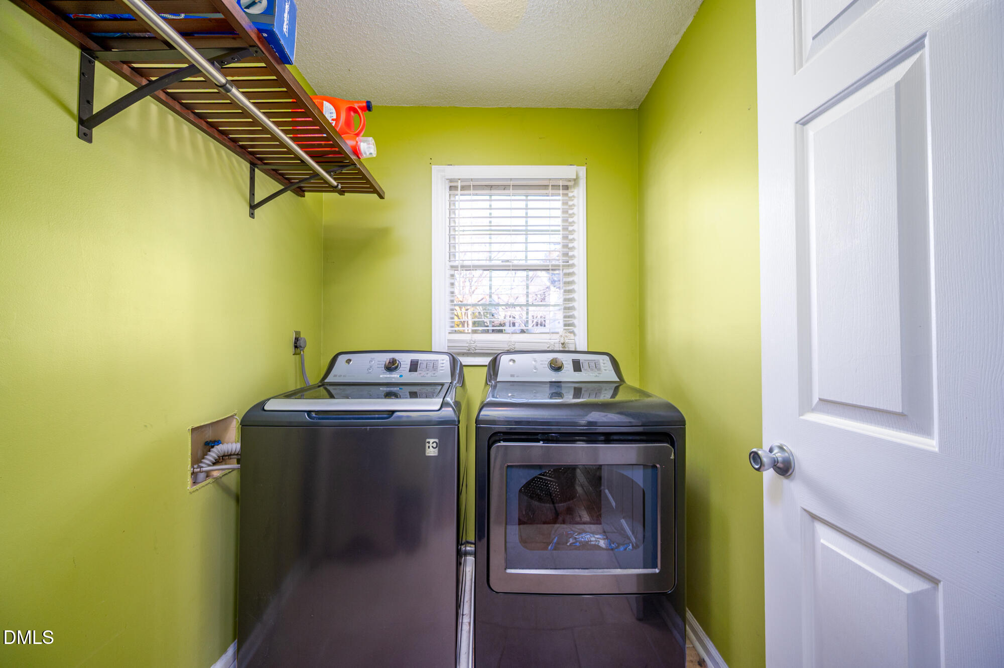 701 Thistlegate Trail Raleigh, NC 27610 - Photo 16 of 53 a utility room with dryer and washer