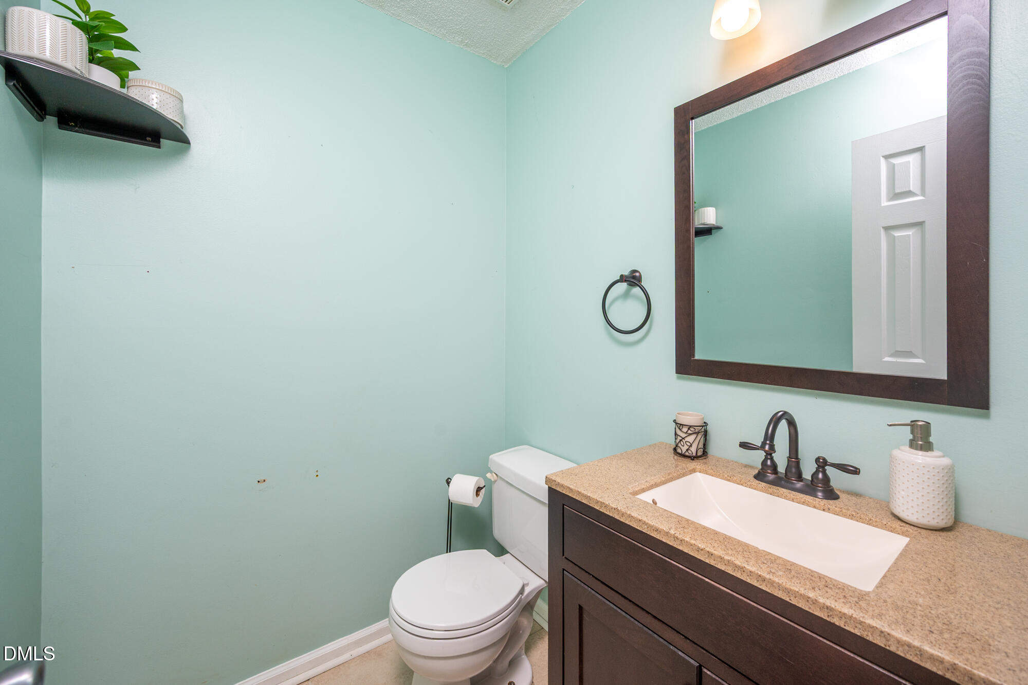 701 Thistlegate Trail Raleigh, NC 27610 - Photo 17 of 53 a bathroom with a granite countertop sink mirror and toilet