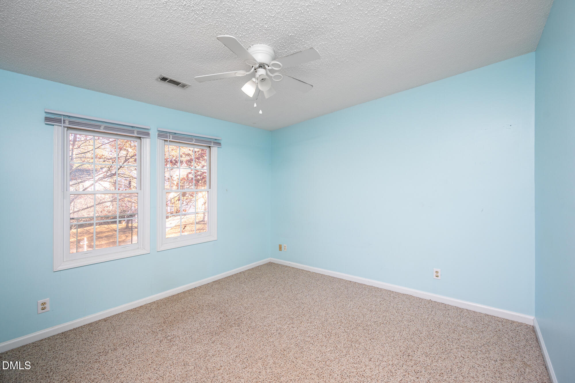 701 Thistlegate Trail Raleigh, NC 27610 - Photo 23 of 53 an empty room with windows and fan