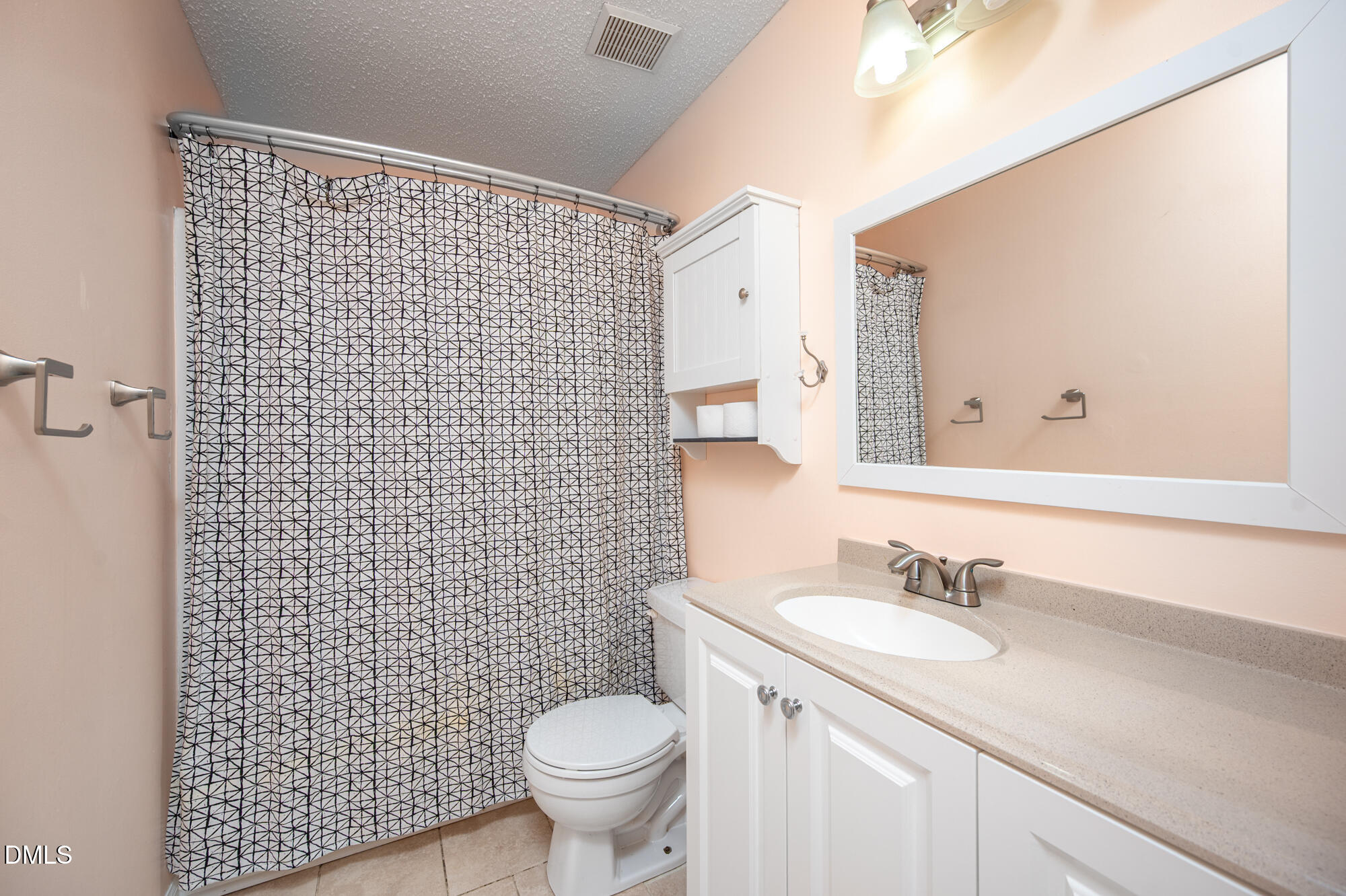 701 Thistlegate Trail Raleigh, NC 27610 - Photo 25 of 53 a bathroom with a sink toilet and shower