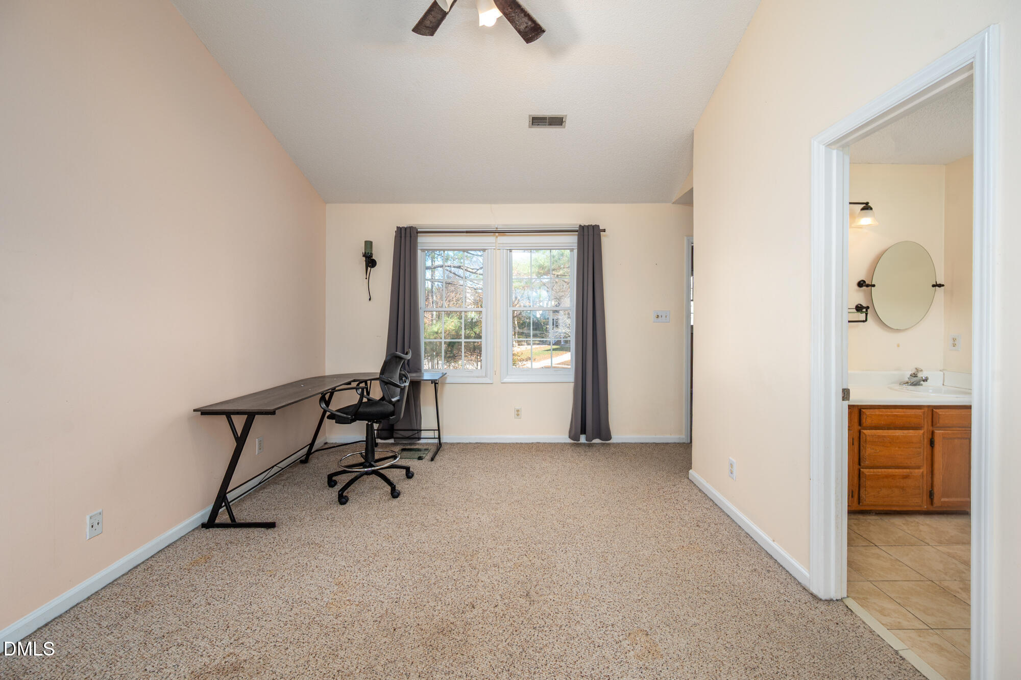 701 Thistlegate Trail Raleigh, NC 27610 - Photo 31 of 53 a view of a workspace with furniture and a window