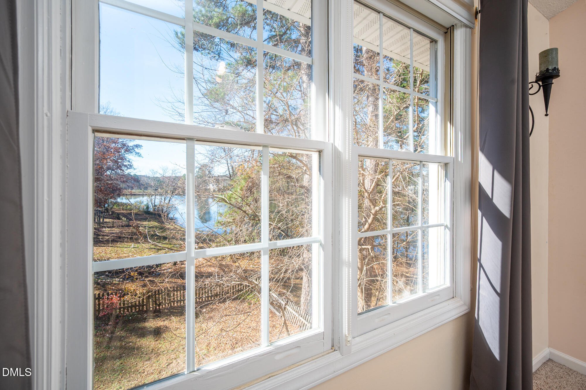 701 Thistlegate Trail Raleigh, NC 27610 - Photo 32 of 53 a view of a room with a large window and wooden floor