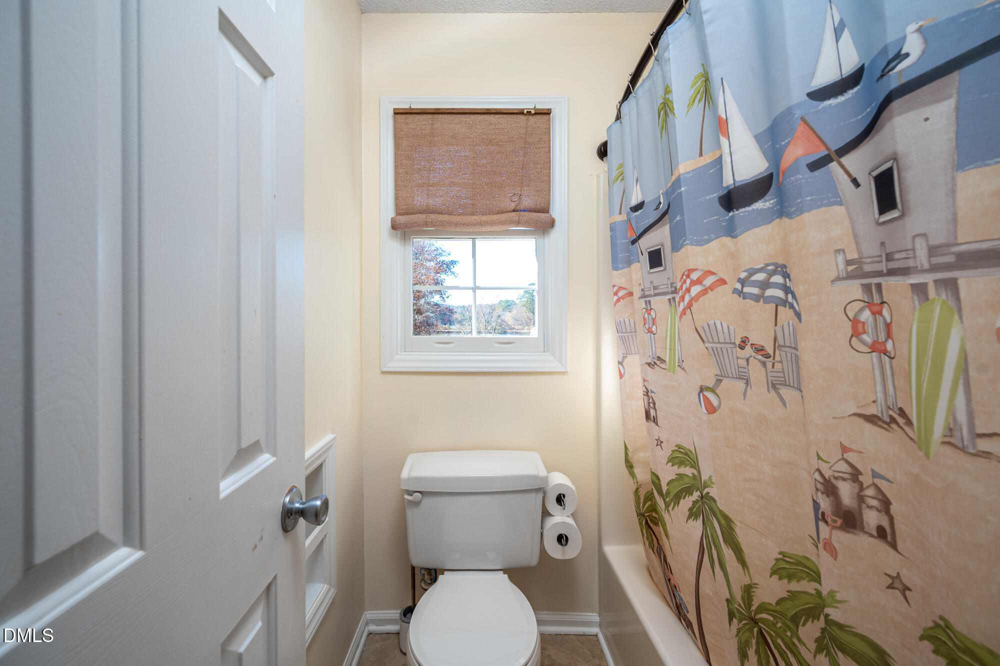 701 Thistlegate Trail Raleigh, NC 27610 - Photo 34 of 53 a white toilet sitting next to a bathroom sink
