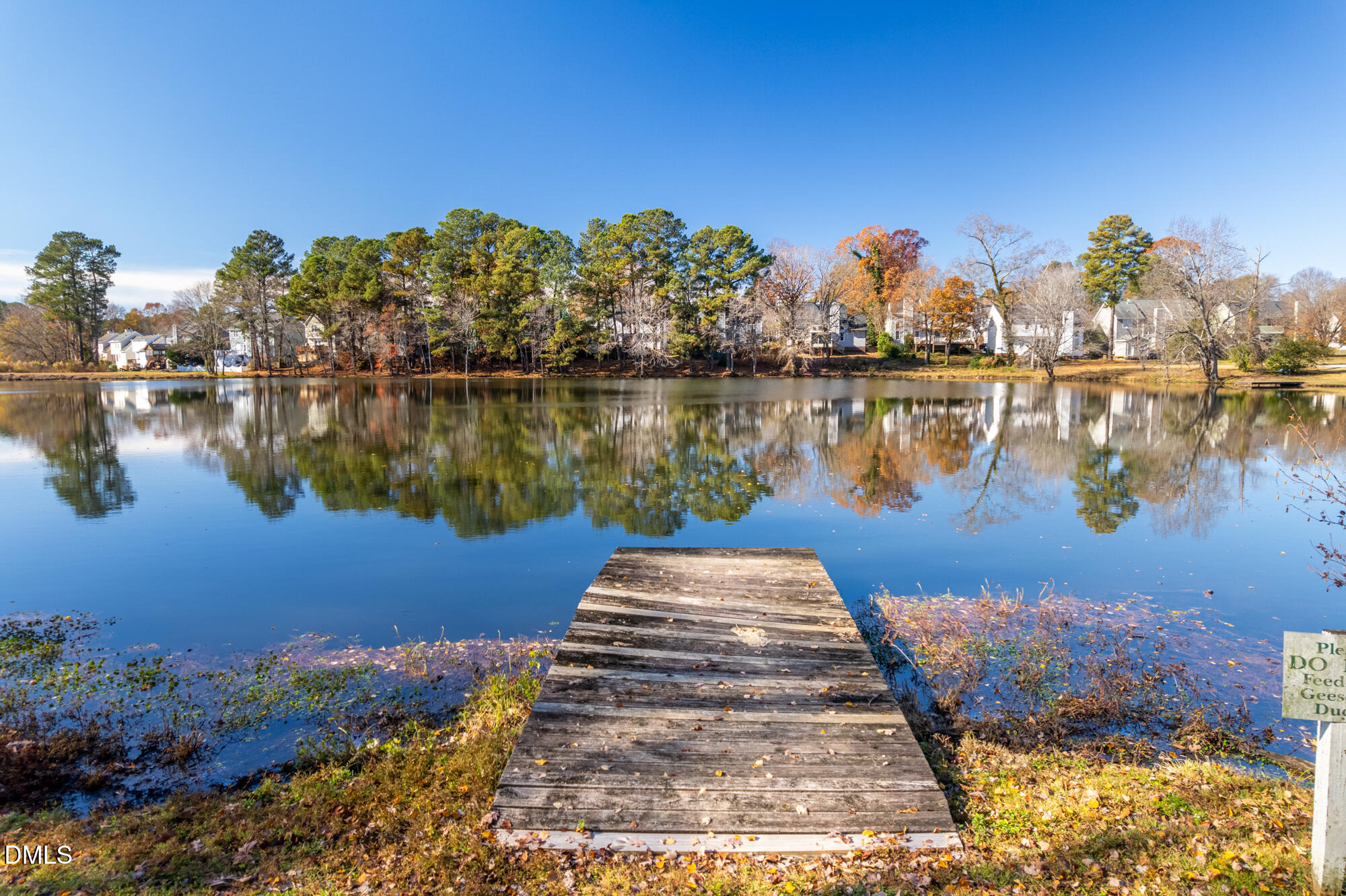 701 Thistlegate Trail Raleigh, NC 27610 - Photo 46 of 53 a view of a lake with houses
