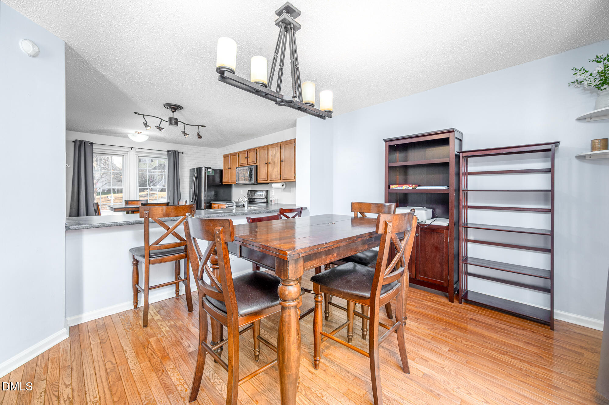 701 Thistlegate Trail Raleigh, NC 27610 - Photo 10 of 53 a dining room with furniture and wooden floor