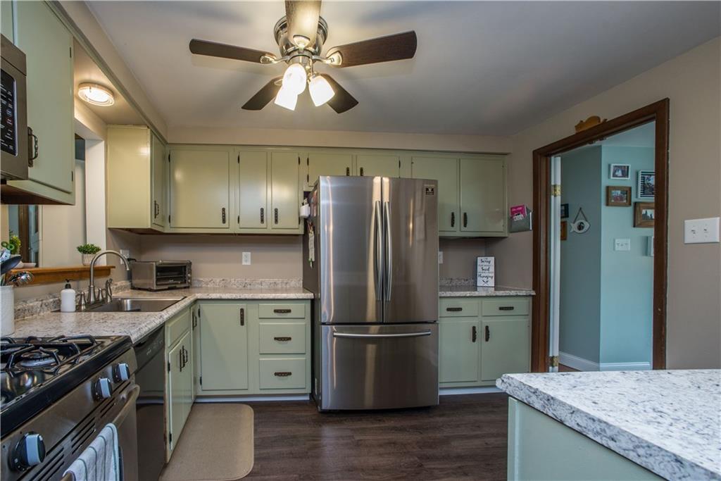 23 Stancey Road Pittsburgh, PA 15220 - Photo 8 of 25 Beautiful updates include new flooring, new counters and impressive stainless steel fridge.
