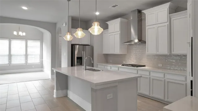 a kitchen with cabinets and window