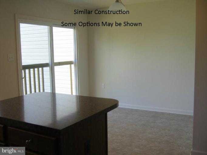 3 Steed Street Ranson, WV 25438 - Photo 12 of 25 a view of a kitchen from the hallway