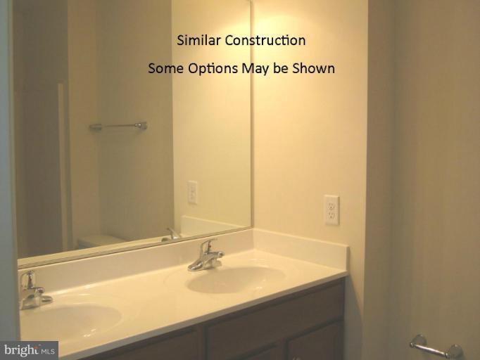 3 Steed Street Ranson, WV 25438 - Photo 17 of 25 a bathroom with a sink and a mirror