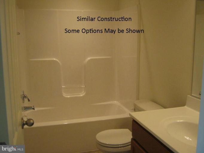 3 Steed Street Ranson, WV 25438 - Photo 20 of 25 a bathroom with a sink a toilet and a bathtub