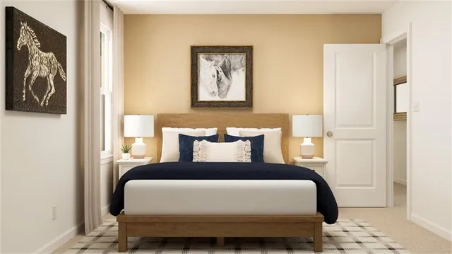 a bedroom with a bed and a painting on the wall