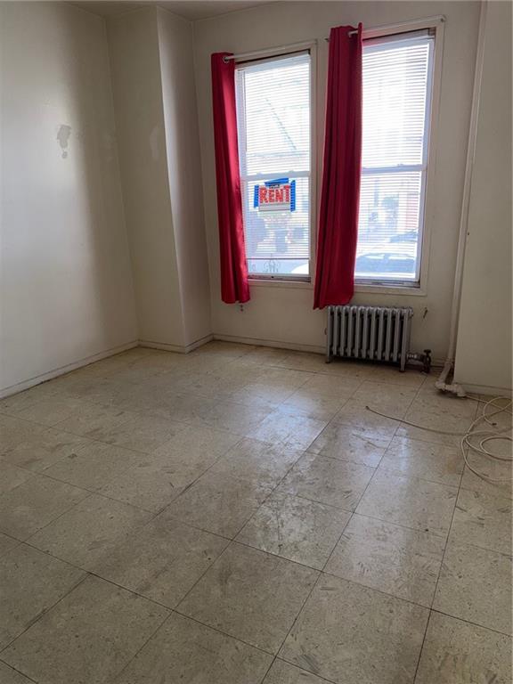 1362 68th Street Brooklyn, NY 11219 - Photo 3 of 11 an empty room with windows