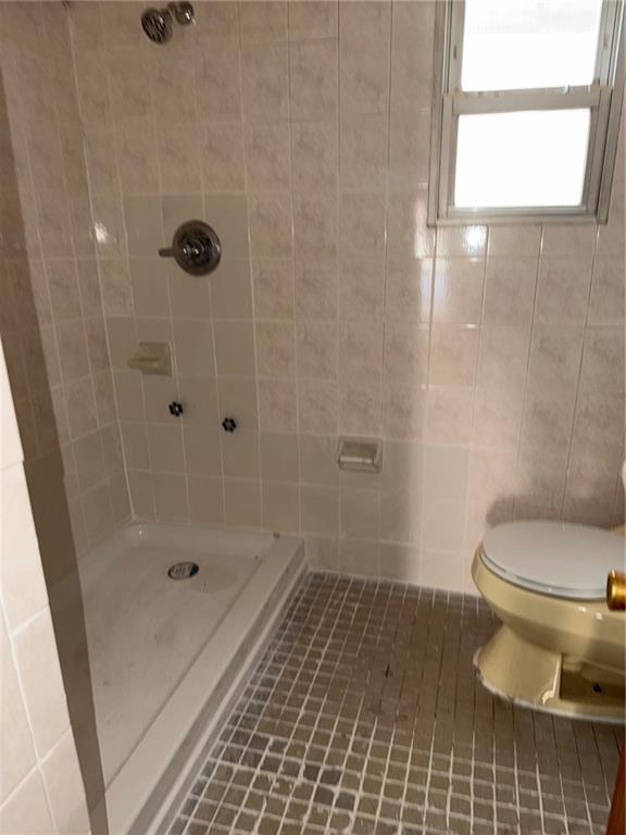 1362 68th Street Brooklyn, NY 11219 - Photo 5 of 11 a bathroom with a toilet and a shower