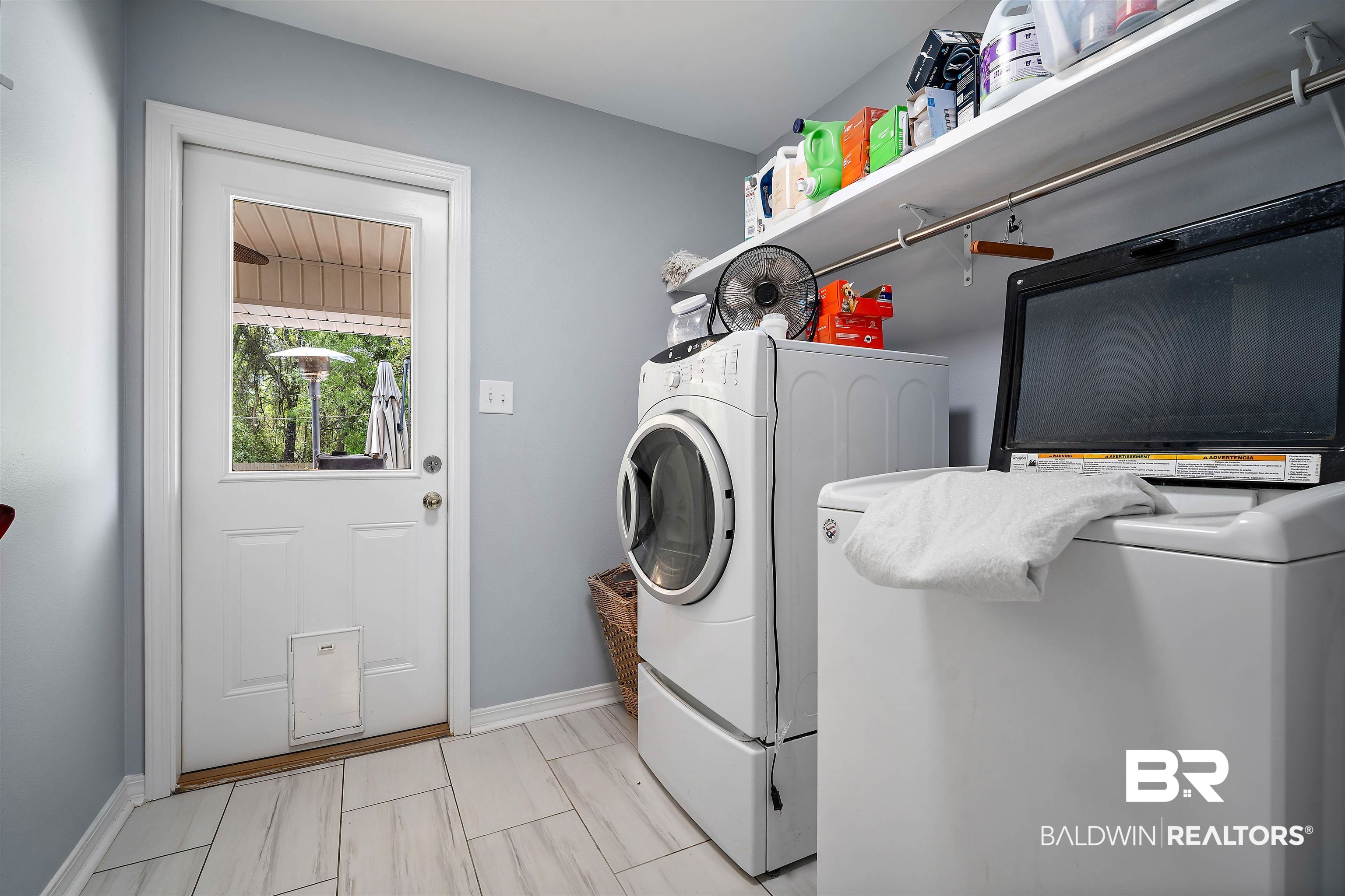 10713 Rigby Drive Mobile, AL 36695 - Photo 28 of 35 Laundry room featuring independent washer and dryer and baseboards