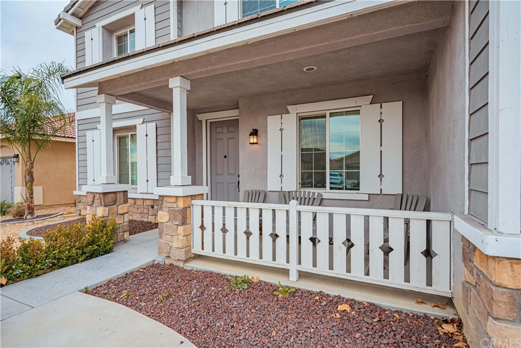 2090 Trinket Circle San Jacinto, CA 92582 - Photo 4 of 43 a view of a house with porch and wooden floor