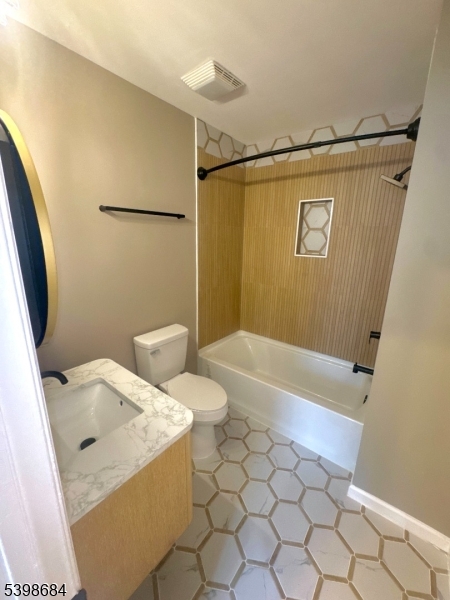239 40th Street, Unit 7 Irvington, NJ 07111 - Photo 7 of 11 a bathroom with a sink and a shower
