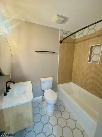 a bathroom with a toilet and a sink