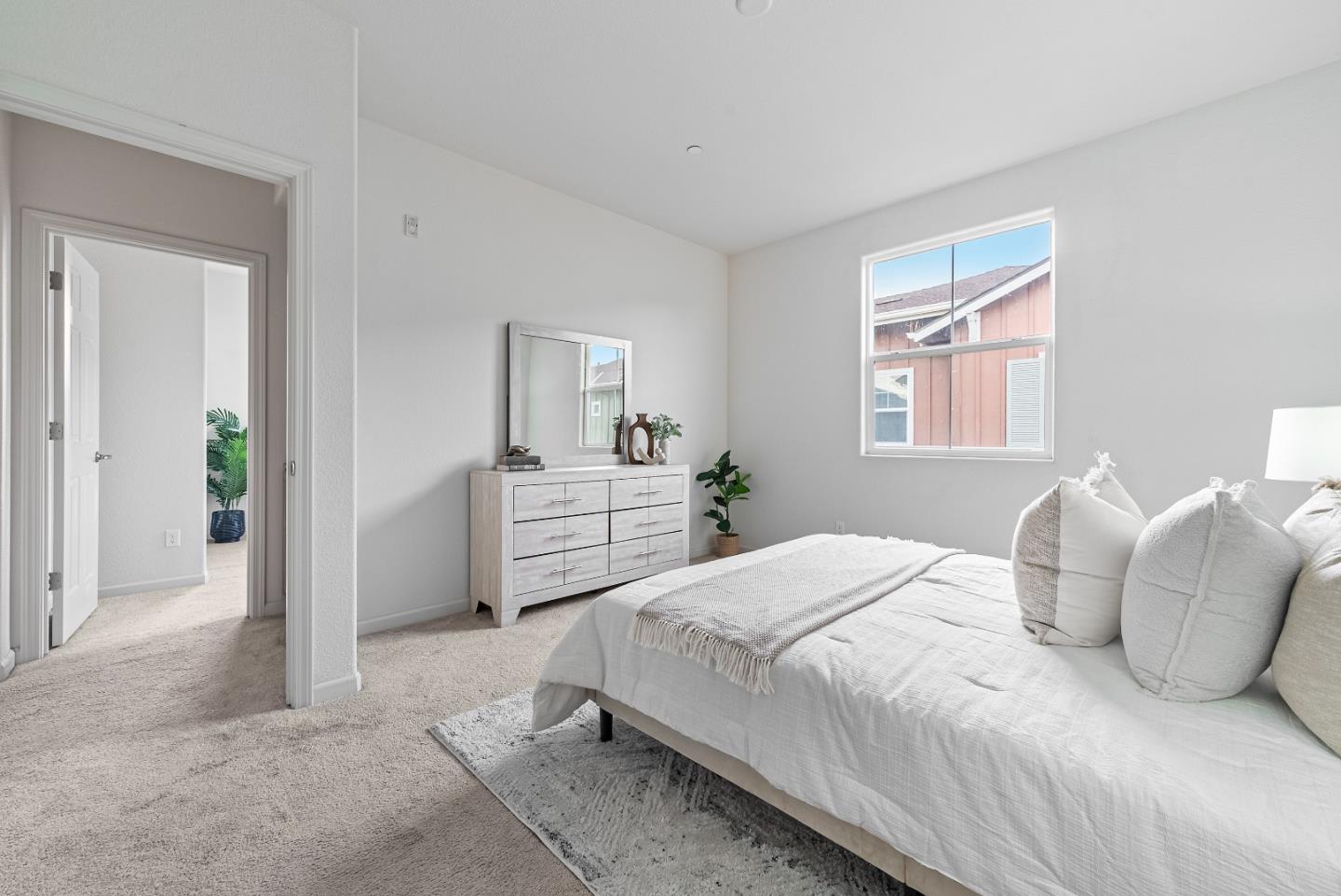 1088 Mallow Terrace San Jose, CA 95133 - Photo 21 of 36 a bedroom with a bed and a window