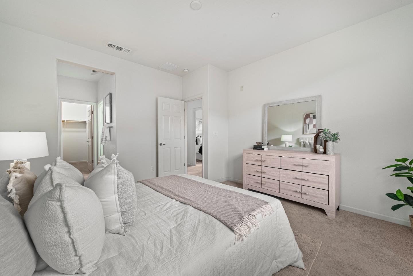 1088 Mallow Terrace San Jose, CA 95133 - Photo 22 of 36 a bedroom with a bed and a dresser