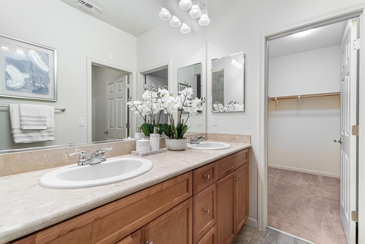 1088 Mallow Terrace San Jose, CA 95133 - Photo 27 of 36 a bathroom with a granite countertop sink and a mirror