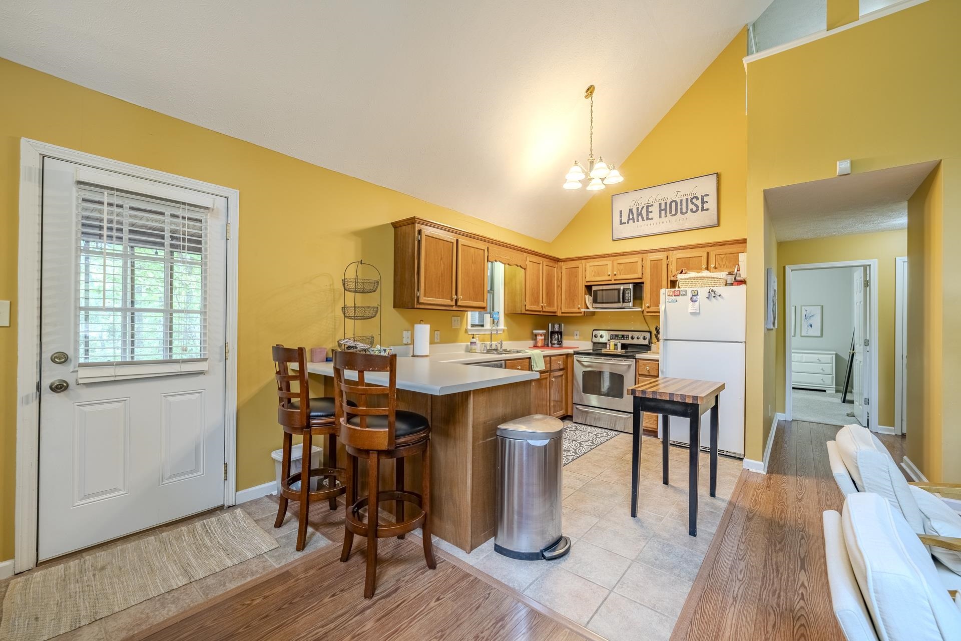 405 Murray Lane Counce, TN 38326 - Photo 14 of 36 a kitchen with a table chairs and wooden floor
