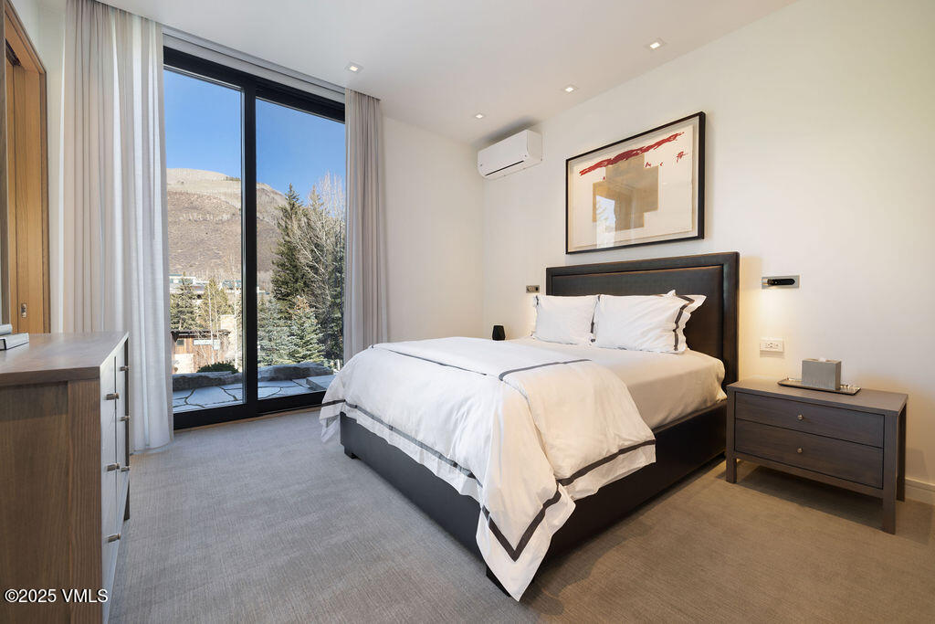 254 Beaver Dam Road Vail, CO 81657 - Photo 34 of 46 a bed room with a bed and a large window