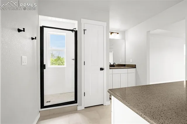 a view of hallway with stairs and wooden floor