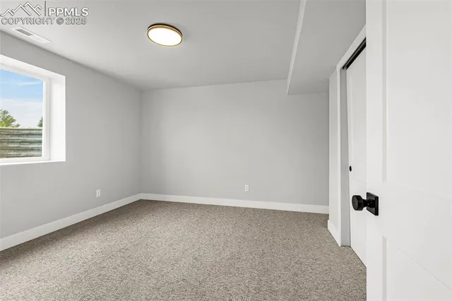 a view of an empty room and window