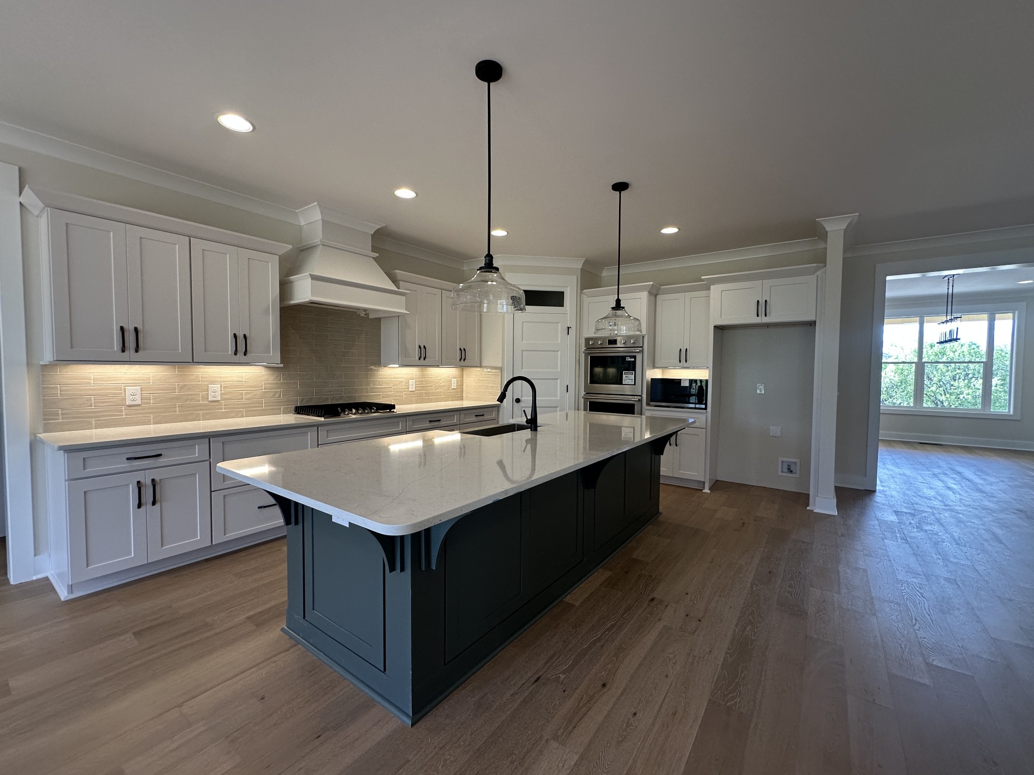 1576 Frye Road Columbia, TN 38401 - Photo 22 of 66 a kitchen with kitchen island granite countertop a sink appliances and cabinets