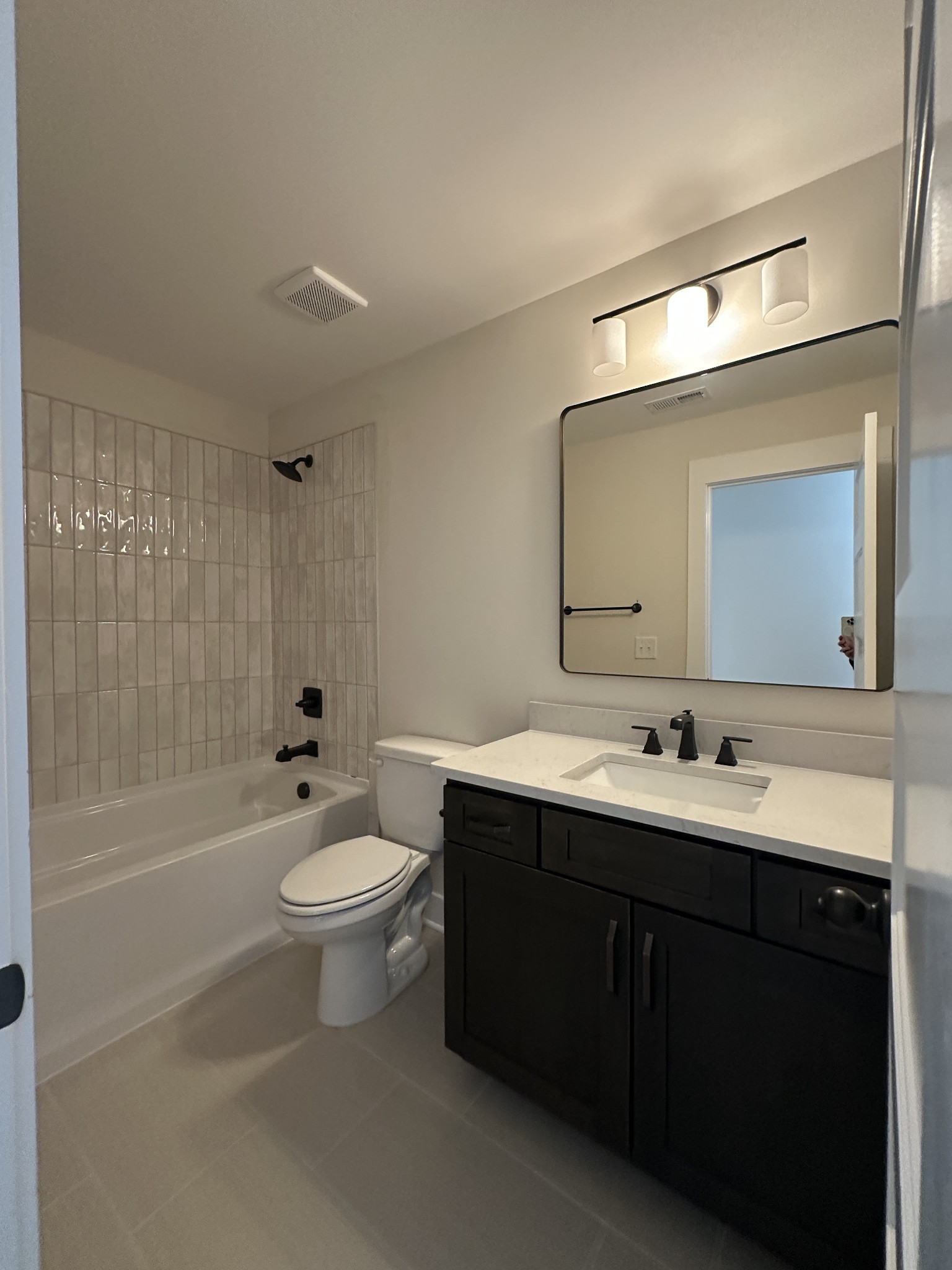 1576 Frye Road Columbia, TN 38401 - Photo 51 of 66 a bathroom with a double vanity sink toilet mirror and bathtub