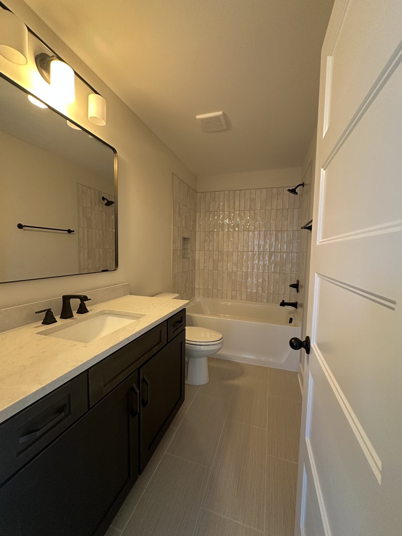 1576 Frye Road Columbia, TN 38401 - Photo 53 of 66 a bathroom with a double vanity sink toilet mirror and shower