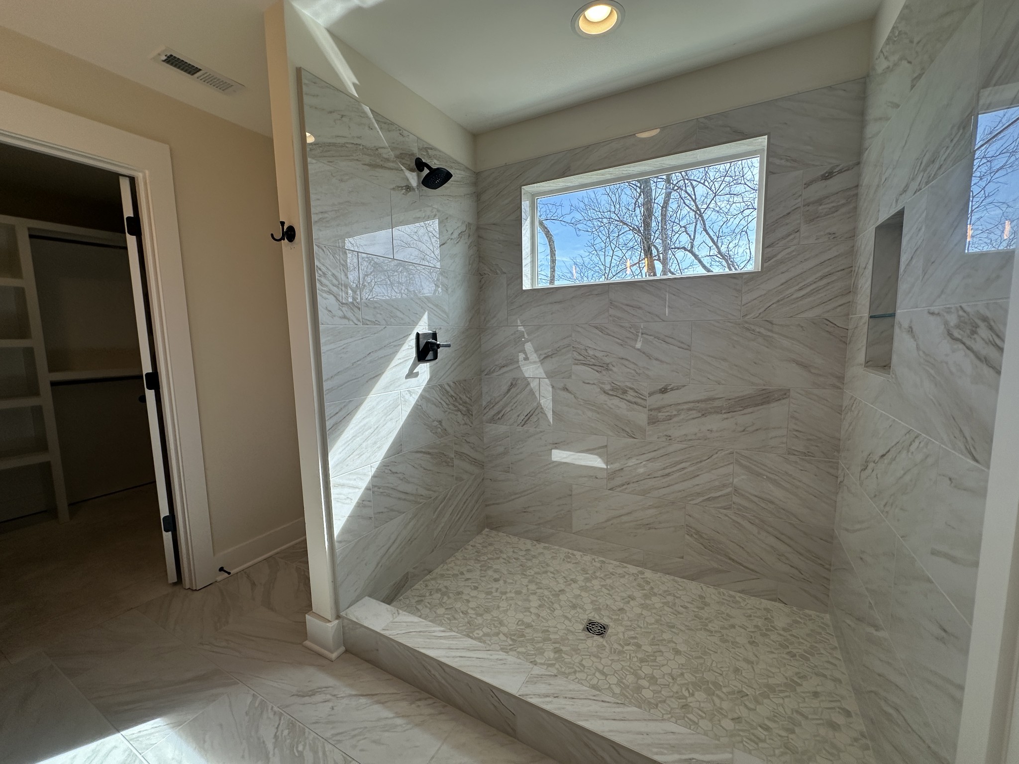 1576 Frye Road Columbia, TN 38401 - Photo 60 of 66 a bathroom with a glass shower door