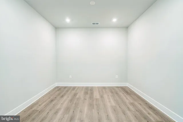 a view of room with wooden floor