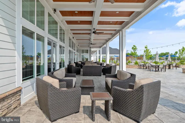 a outdoor living space with patio furniture and a potted plant