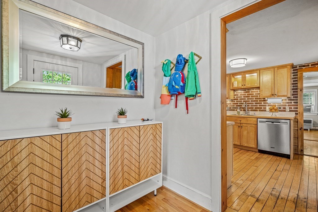 52 Morton Street Andover, MA 01810 - Photo 11 of 27 a view of kitchen with stainless steel appliances cabinets and a large window