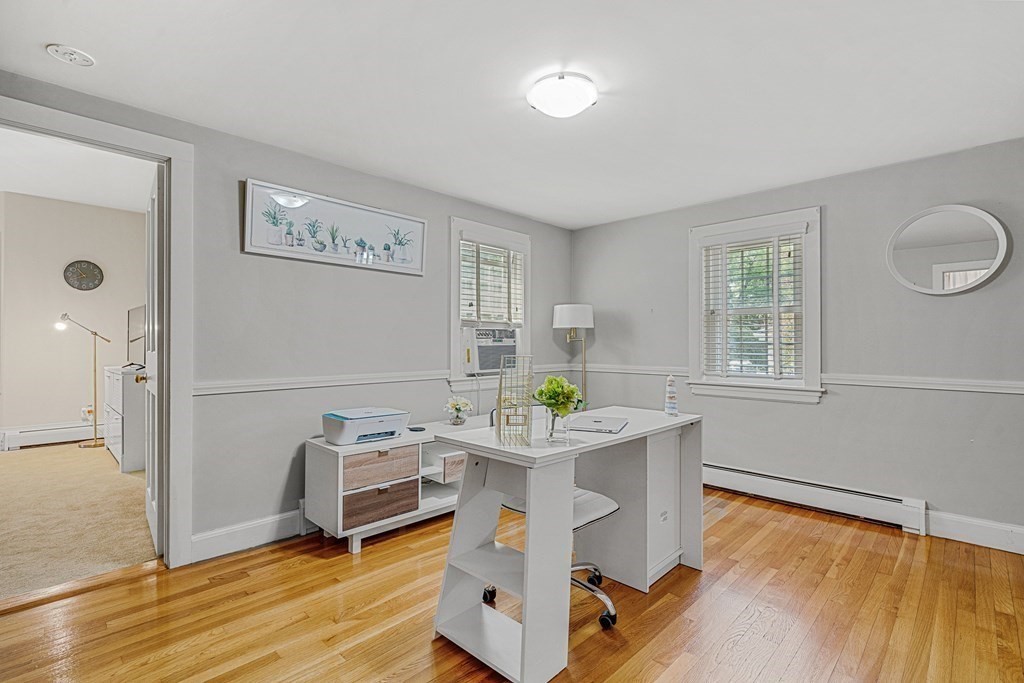 52 Morton Street Andover, MA 01810 - Photo 15 of 27 a room with furniture and a wooden floor