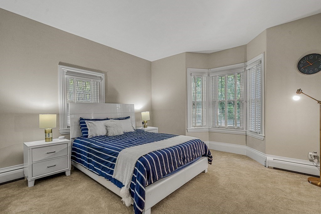 52 Morton Street Andover, MA 01810 - Photo 16 of 27 a bedroom with a bed and a window