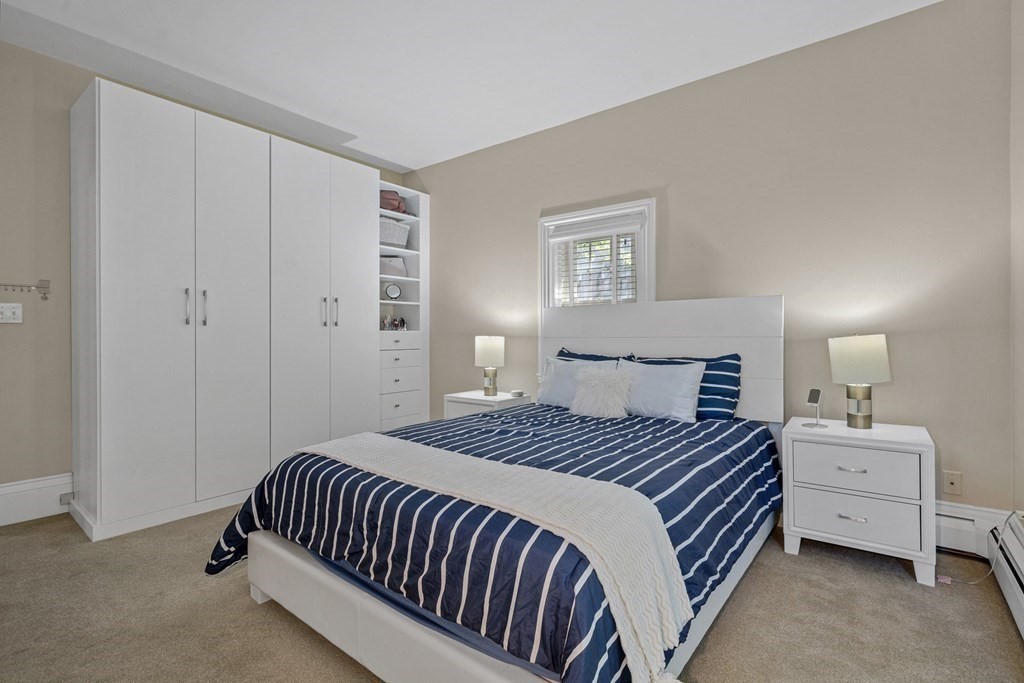 52 Morton Street Andover, MA 01810 - Photo 17 of 27 a bedroom with a bed and a lamp